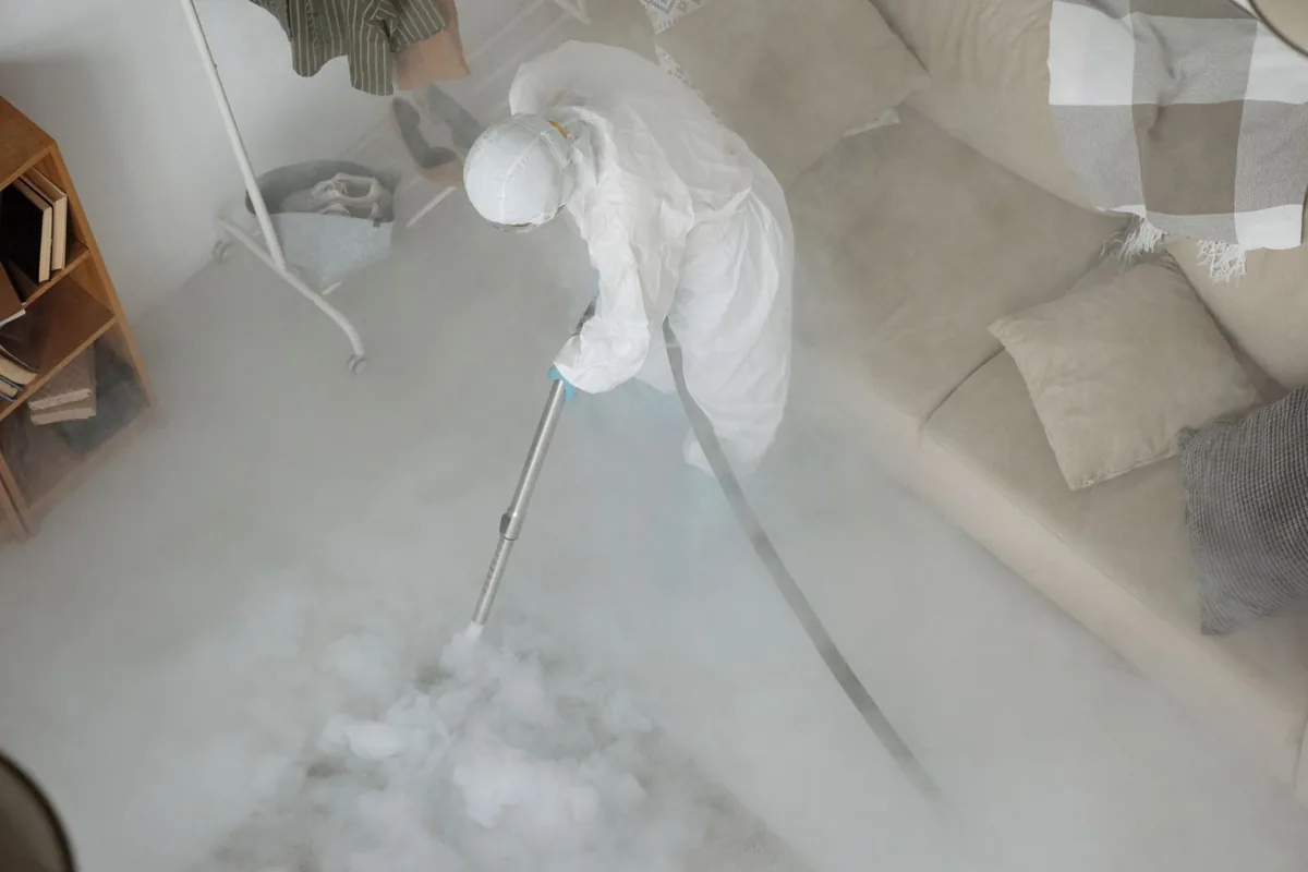 Biohazard cleanup technician in protective equipment, Carrollton, VA